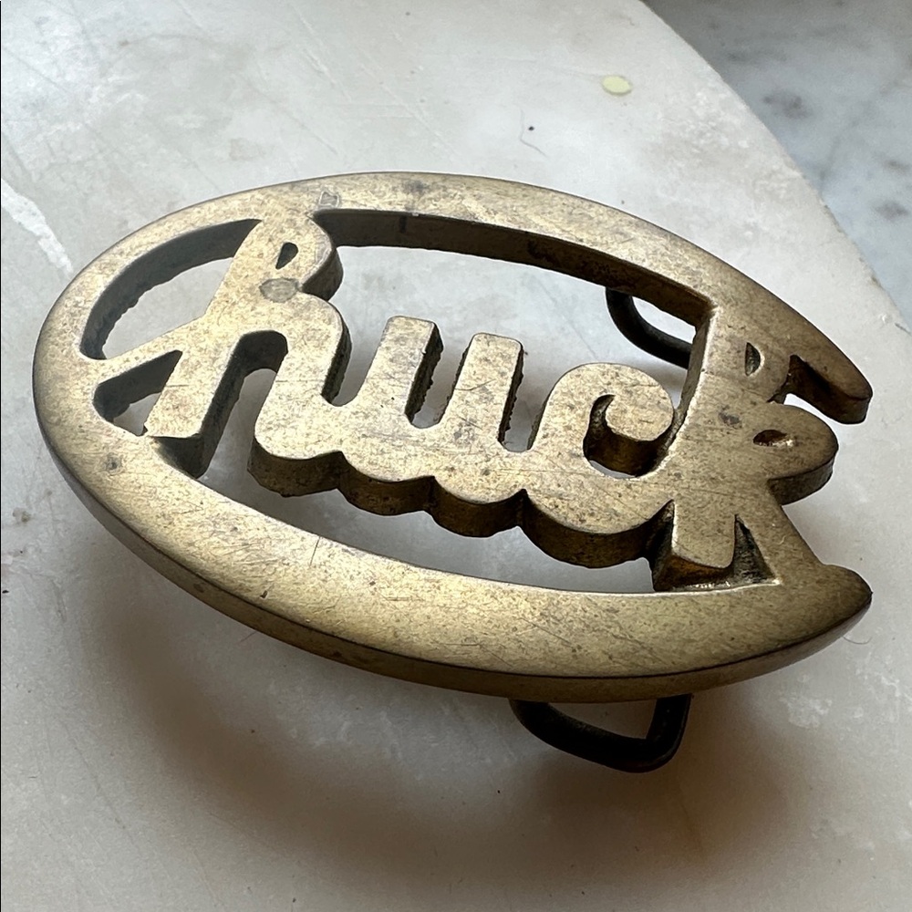 Vintage solid brass CHUCK or HUCK Belt Buckle
